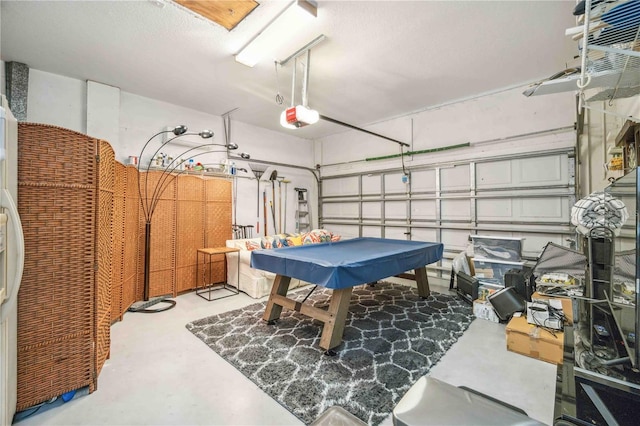 playroom featuring a garage and concrete floors