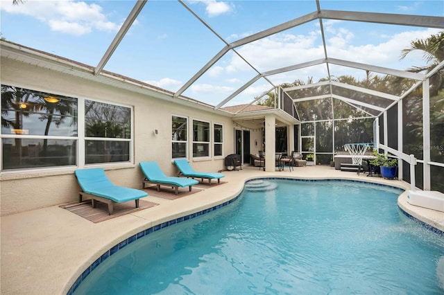 pool with a patio and a lanai