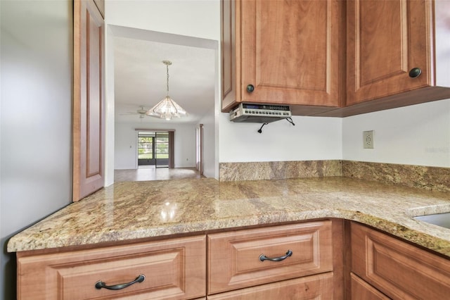 kitchen with pendant lighting and brown cabinets