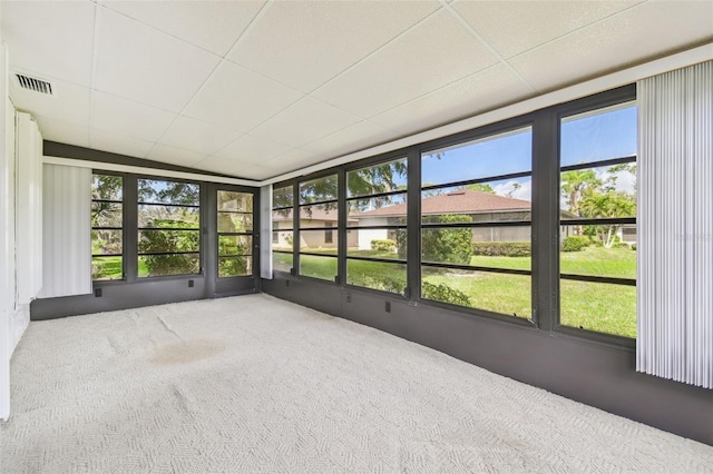 unfurnished sunroom featuring a paneled ceiling and visible vents