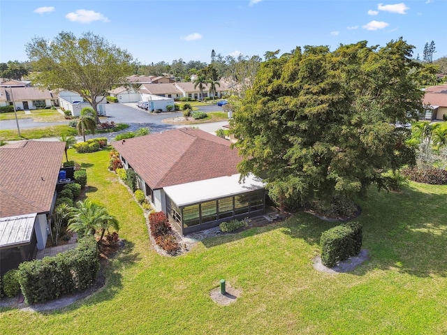 birds eye view of property with a residential view