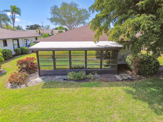 view of yard featuring a sunroom