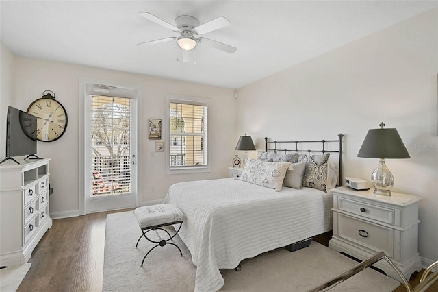 bedroom with access to outside, wood finished floors, a ceiling fan, and baseboards