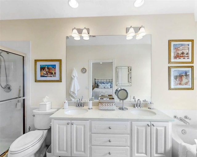 ensuite bathroom featuring toilet, double vanity, a sink, and ensuite bathroom