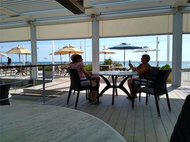 dock area featuring a deck with water view