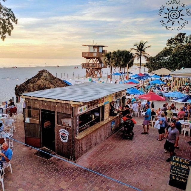 exterior space with a water view and a bar