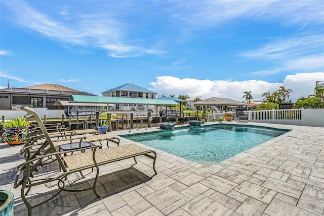 view of swimming pool featuring fence and a fenced in pool