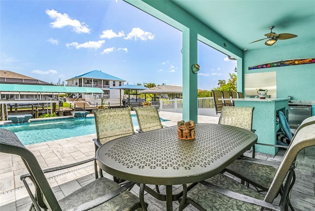 exterior space featuring a ceiling fan