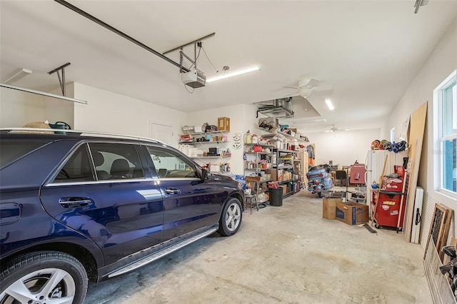 garage featuring ceiling fan and a garage door opener