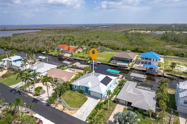 bird's eye view featuring a water view and a residential view