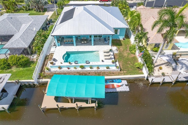 birds eye view of property with a water view