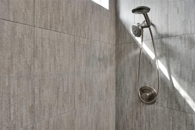 room details with a tile shower