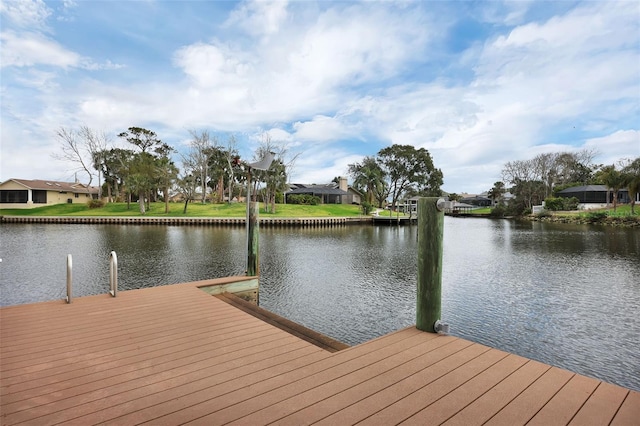 dock area with a water view and a residential view