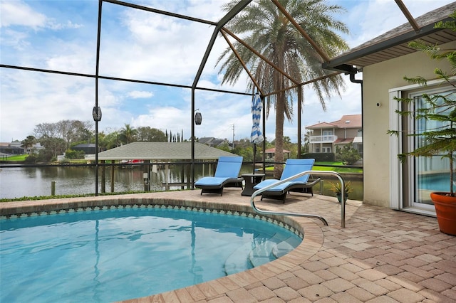 pool featuring a patio area, a lanai, and a water view