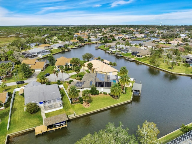 birds eye view of property featuring a water view and a residential view