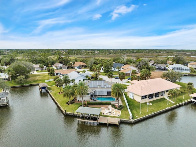 birds eye view of property featuring a residential view and a water view