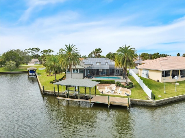 view of dock featuring a water view, boat lift, an outdoor pool, and a lawn