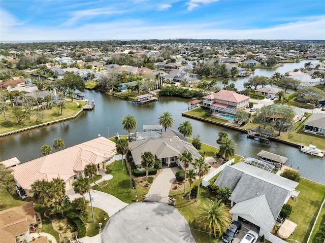 bird's eye view with a water view and a residential view