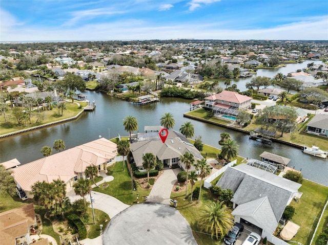 bird's eye view featuring a residential view and a water view