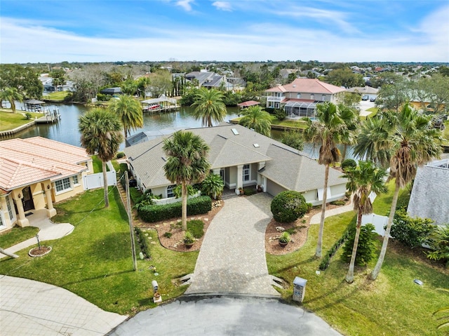 birds eye view of property with a residential view and a water view