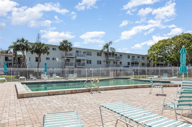 pool featuring a patio and fence