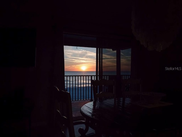 dining space with a water view