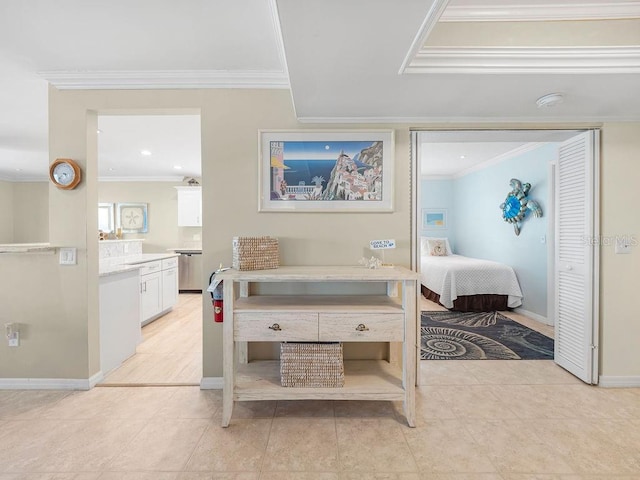 bedroom with light tile patterned floors, baseboards, and ornamental molding