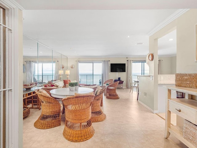 dining room with baseboards, recessed lighting, plenty of natural light, and crown molding