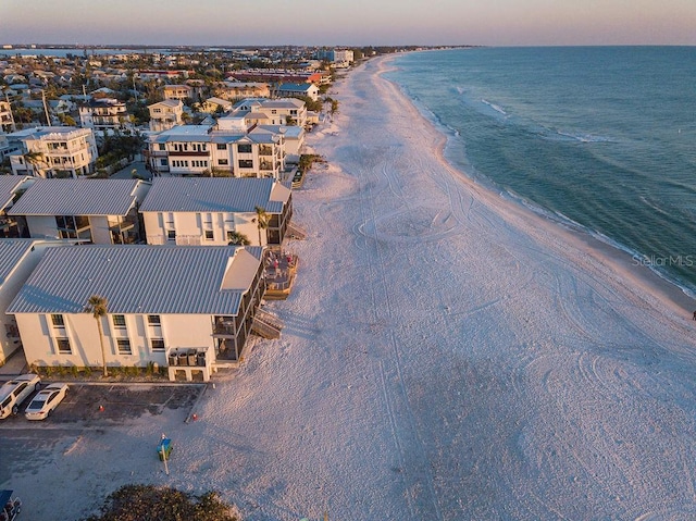 birds eye view of property featuring a water view and a view of the beach