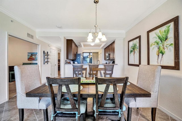 tiled dining space with baseboards, crown molding, visible vents, and a notable chandelier