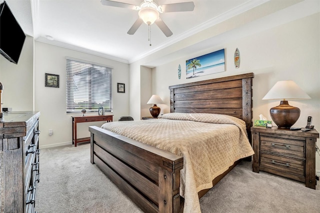 bedroom with ornamental molding, light colored carpet, ceiling fan, and baseboards