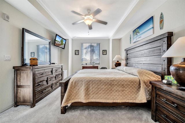 bedroom with crown molding, a ceiling fan, and light colored carpet