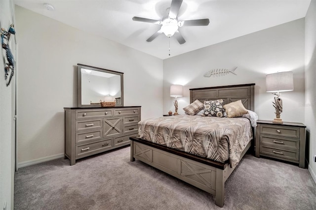 bedroom featuring baseboards, ceiling fan, and light colored carpet