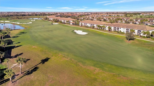 bird's eye view featuring a water view and golf course view