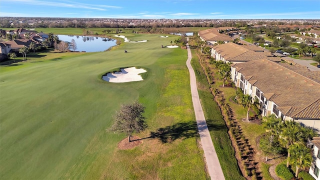 aerial view featuring a water view, a residential view, and golf course view