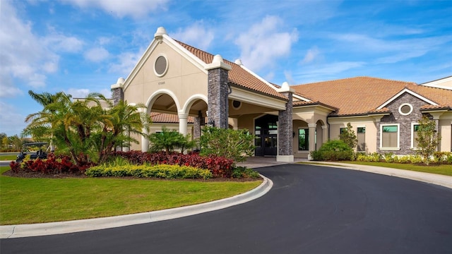 view of property featuring aphalt driveway