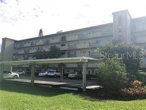 view of partially covered parking lot