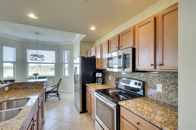 kitchen featuring light tile patterned flooring, stainless steel appliances, a sink, backsplash, and crown molding