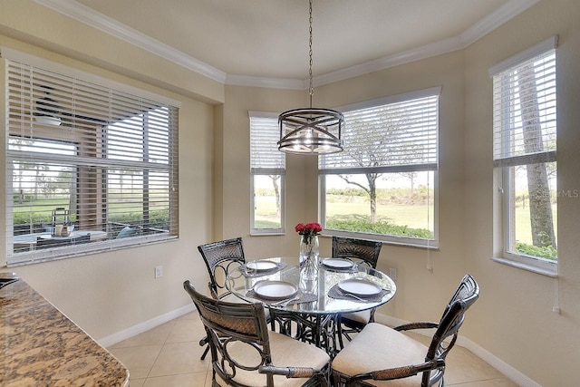 dining room featuring ornamental molding, a healthy amount of sunlight, and light tile patterned floors