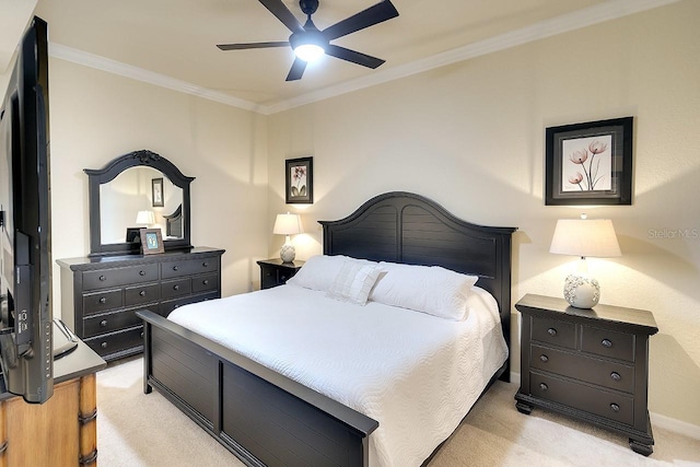 bedroom with crown molding, baseboards, a ceiling fan, and light colored carpet