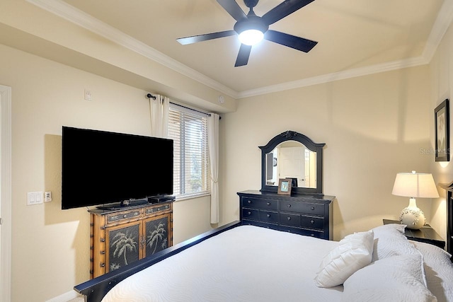 bedroom with ceiling fan and ornamental molding