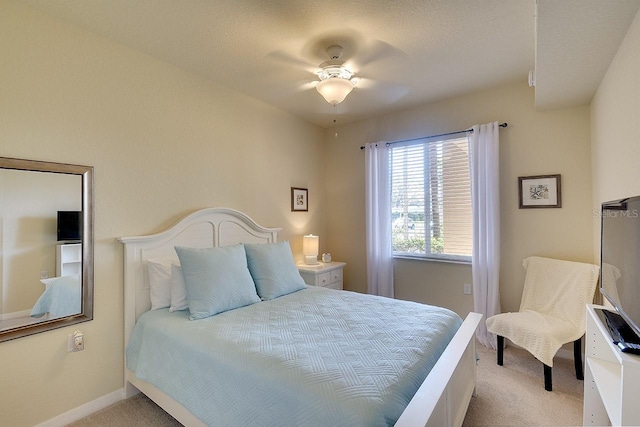 bedroom with carpet floors, ceiling fan, and baseboards