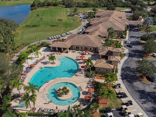 aerial view featuring a water view and golf course view