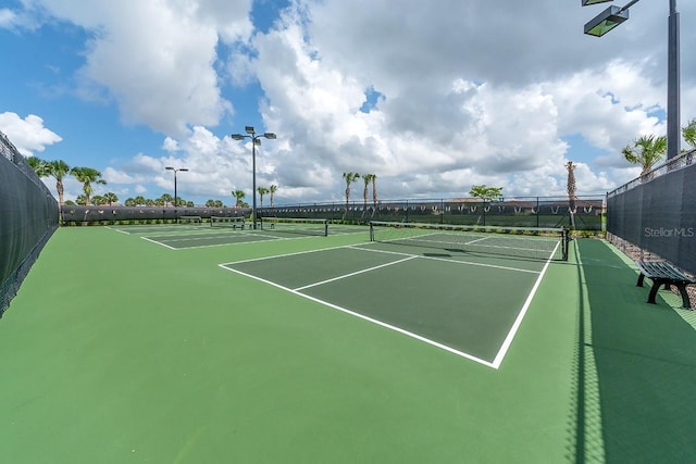 view of sport court with fence