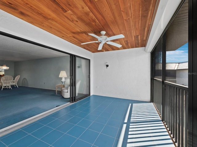 view of patio / terrace featuring a balcony and a ceiling fan