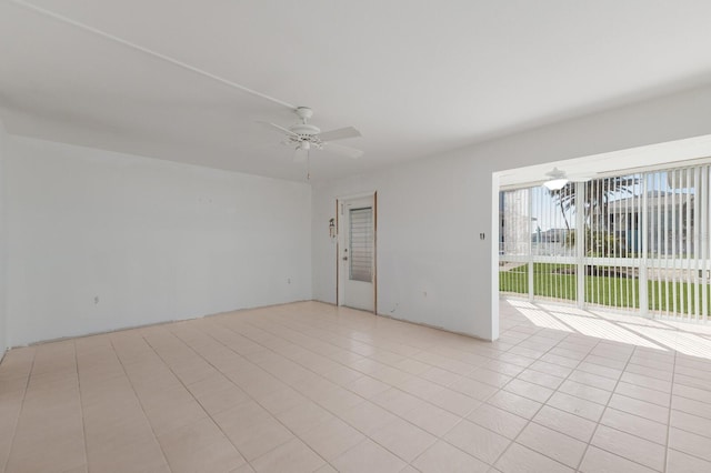 unfurnished room featuring a ceiling fan and light tile patterned flooring