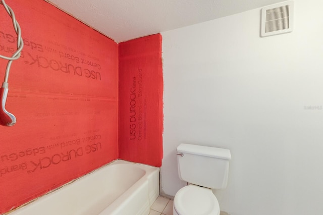 full bath with tile patterned flooring, visible vents, toilet, and a bathing tub