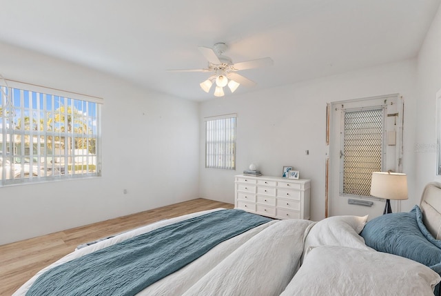 bedroom with wood finished floors and a ceiling fan