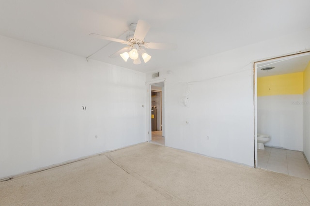 spare room with a ceiling fan and visible vents