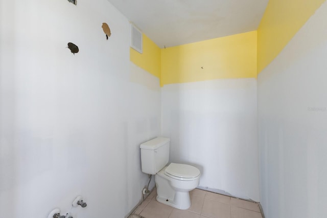 bathroom featuring toilet, tile patterned flooring, and visible vents